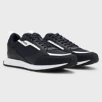 Mixed-material trainers with branded accents1